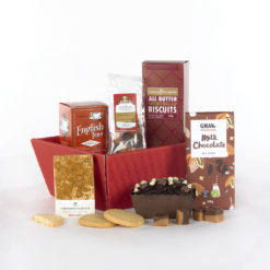 a red gift basket with a mix of snacks and treats