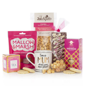 a mug, tea, and sweet treats