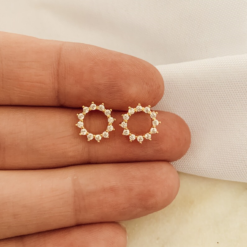 circle stud earrings outlined with cubic zirconia