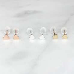 three pairs of heart stud earrings - one silver, one gold, one rose gold