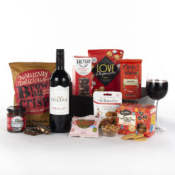a variety of vegan snacks and a bottle of red wine